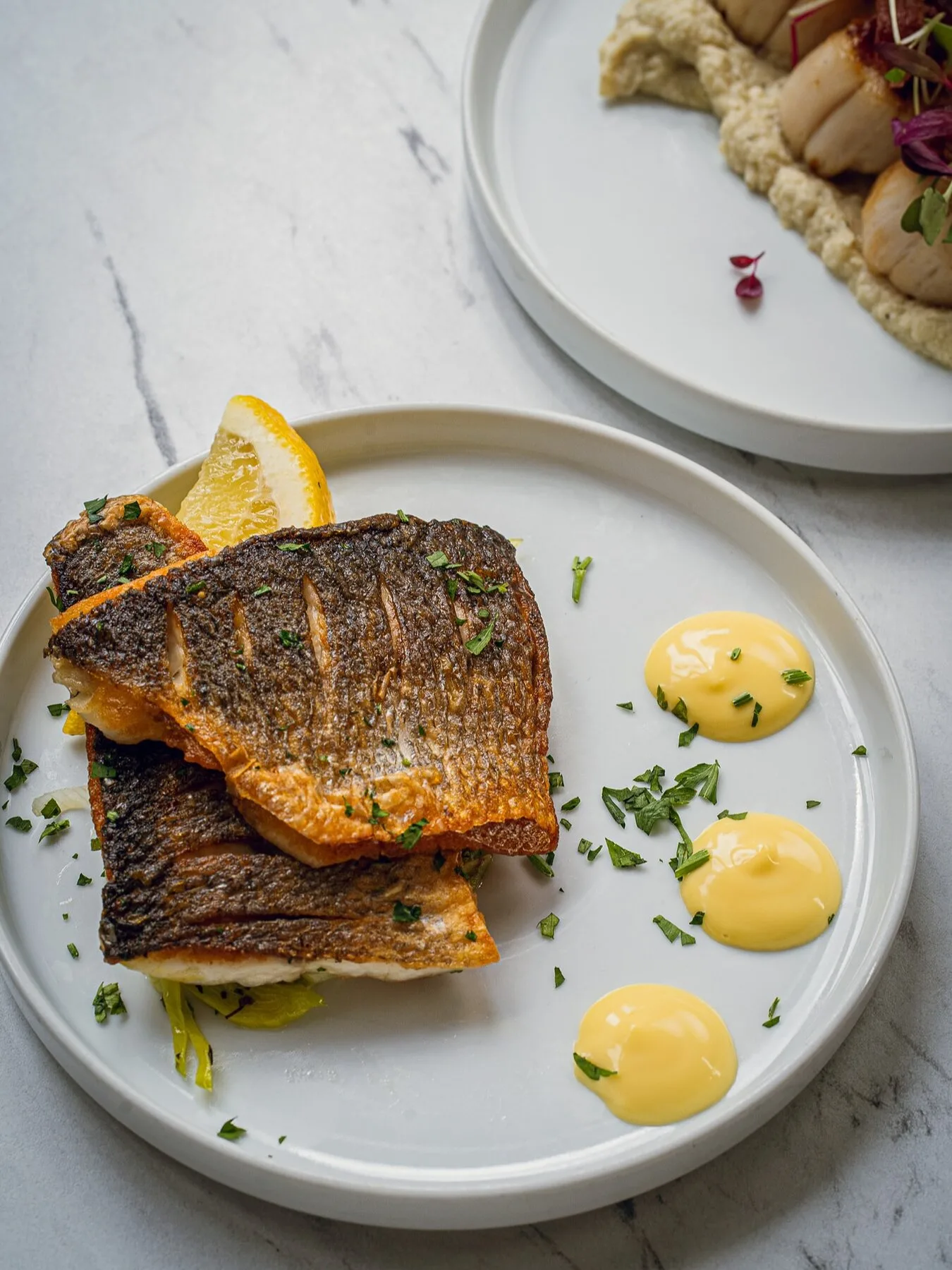Pan-seared sea bass with lemon and herbs at Bistro Franc